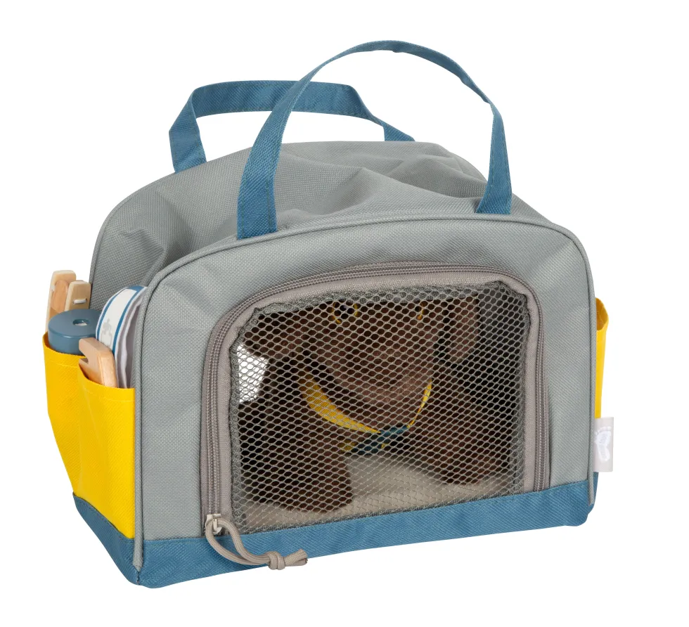 Hund mit Tasche und Pflege-Set