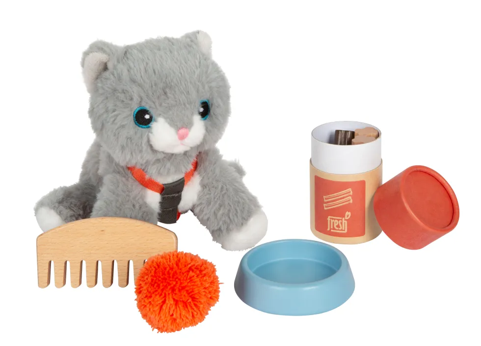 Katze mit Tasche und Pflege-Set
