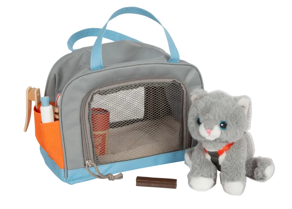 Katze mit Tasche und Pflege-Set